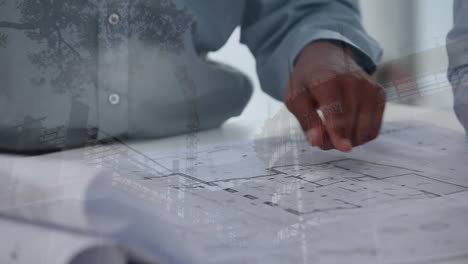 architects discussing over blueprints with construction site