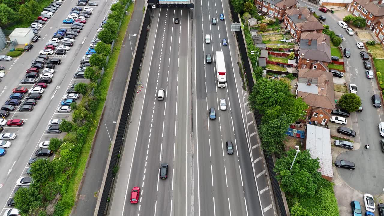 Drone flight over M25 by Holmesdale Tunnel with signs to A10, Enfield and London