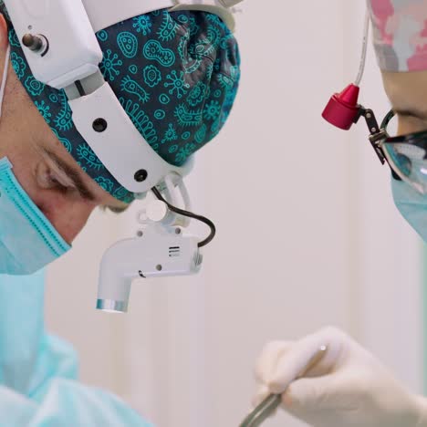 team of surgeons performing surgery