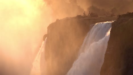 waterfalls with golden sun and cliffs, africa