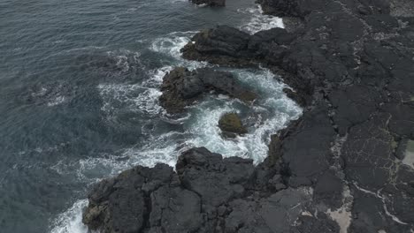 Ocean-sculpting-in-lava-field-as-a-professional-artist