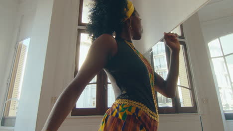 sensual black woman dancing tango during studio rehearsal