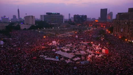 fireworks go off above protestors gathered in tahrir square in cairo egypt as dawn breaks 2