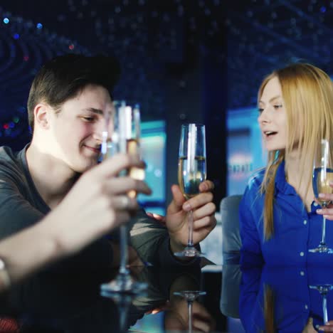 young people relax at a table in a cozy restaurant while they talk and have a good time 10