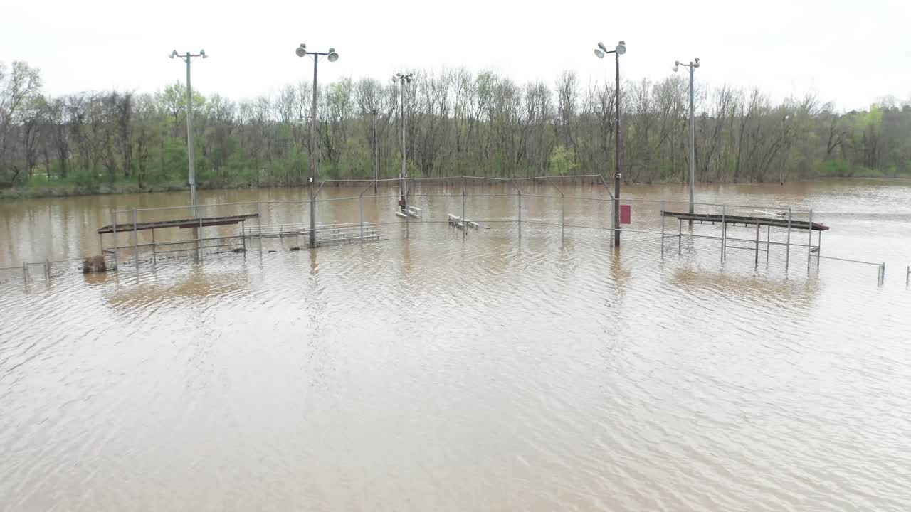 Baseball field flooded under water natural disaster heavy rainfall park or recreational ground
