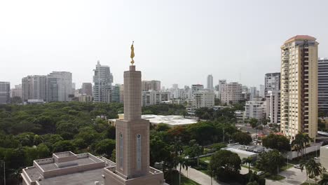 360 view with drone showing from above the church of jesus christ of latter-day saints and its golden statue in the chasm