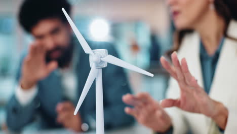 business meeting discussing wind turbine technology for renewable energy