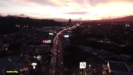 an aerial view of the city of san salvador late in the afternoon.