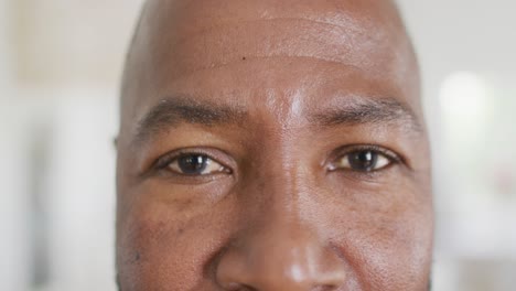 Portrait-of-happy-african-american-man-looking-at-camera-and-smiling