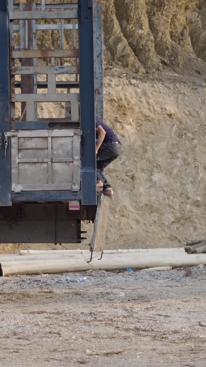 Man securing load on truck