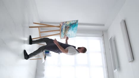 female modern caucasian artist working on painting in studio in evening footage of student sitting female modern caucasian artist working on painting in studio in evening footage of student sitting on floor and painting art therapy concept indoors
