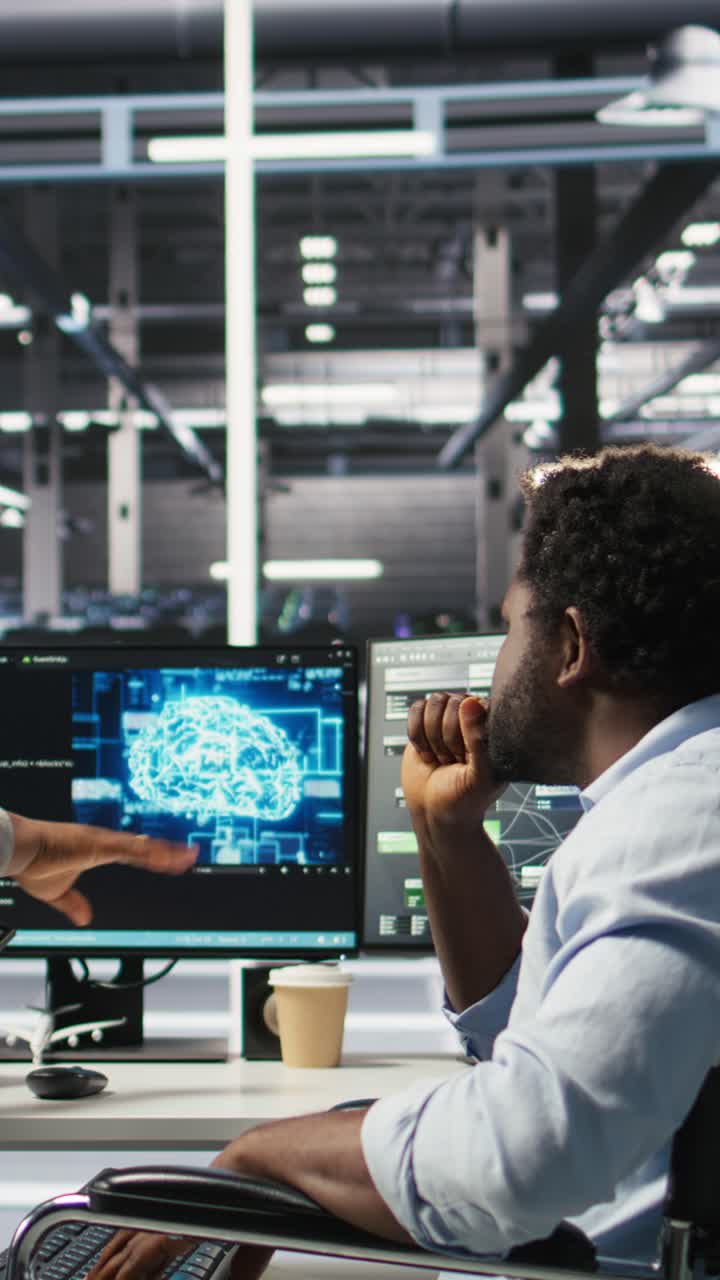 Vertical Video Admin In Wheelchair And Data Center Coworker Work Together Using Node Tree Tool