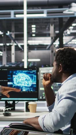 vertical video admin in wheelchair and data center coworker work together using node tree tool