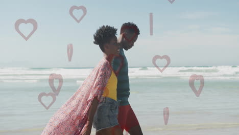 walking on beach, couple with heart shapes overlaying scene in animation