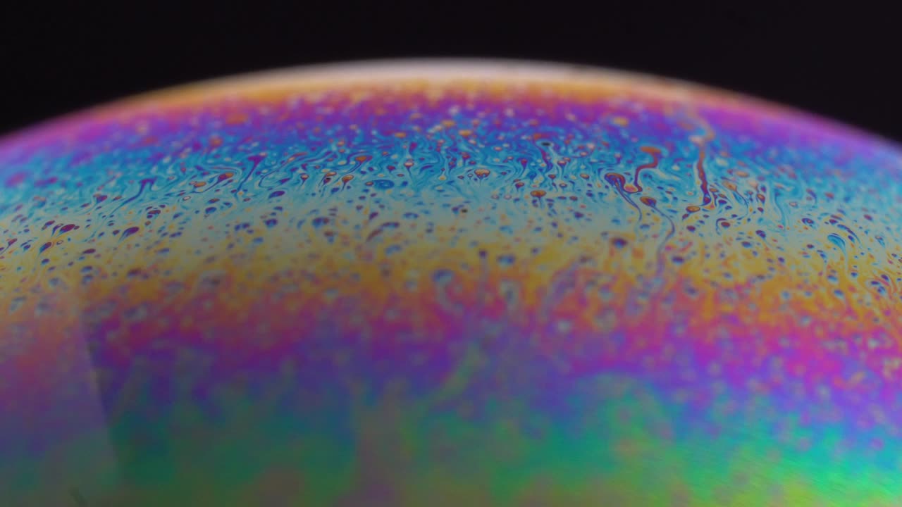 Macro Photography of a Soap Bubble with Rainbow Colors