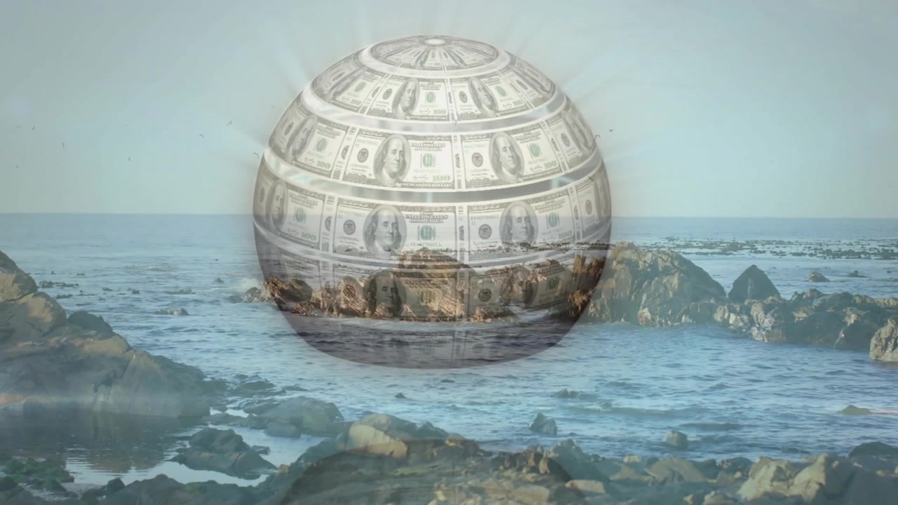 岩の多い海岸の地平線から金融ドルの球体が降下し、透明な殻を通して海が現れる。