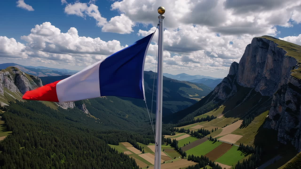 French Flag Waving over Alpine Peaks