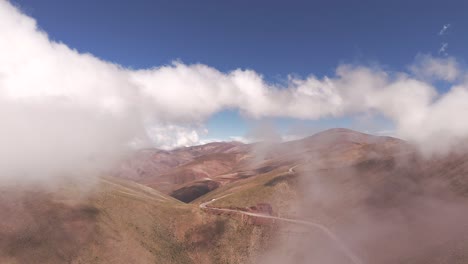 aerial drone pan in clouds overlooking canyon below along route 52