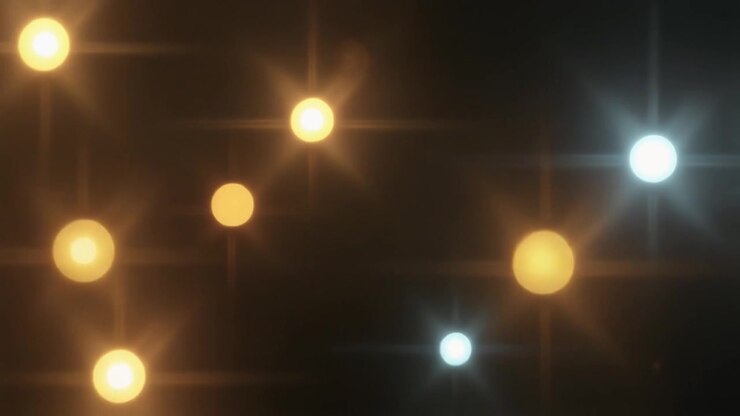 Sfondo astratto con sfere di luce dorate e blu luminose