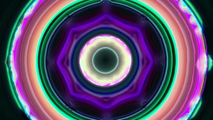 Imagem abstrata com círculos concêntricos em tons vibrantes de verde e rosa