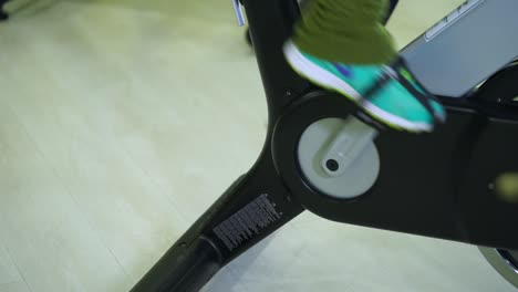 person cycling on a stationary bike