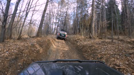 4x4 cars riding through the muddy forest - gopro 4k window view