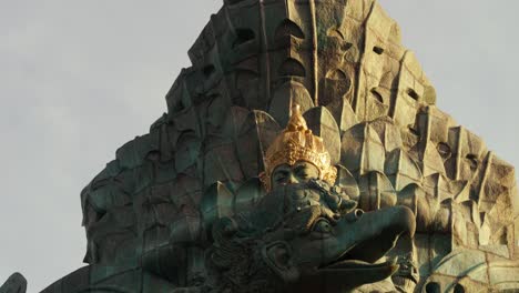 Tilt-up-shot-of-the-great-sacred-statue-cultural-parc-in-bali-garuda-wisnu-kencana-indonesia-with-view-of-the-various-gods