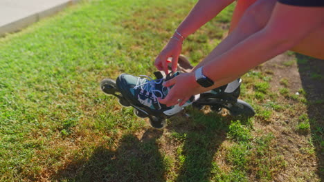 woman putting on roller skates outdoors