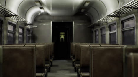 dark and abandoned train interior with empty seats in a derelict environment