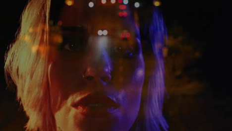 female teen gazing forward in urban night tech scene, showcasing cinematic bokeh and color glow