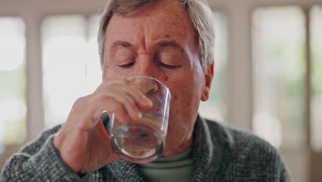 pills, drinking water and senior man at home