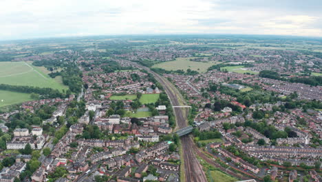 drone shot over train tracks leaving york england