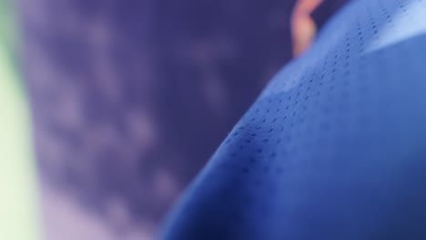 close-up of blue textured fabric with blurry background