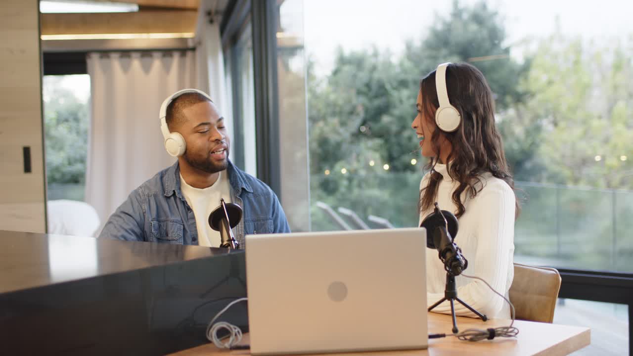 Podcast co-hosts entering studio starting microphone and headphone adjustment for recording
