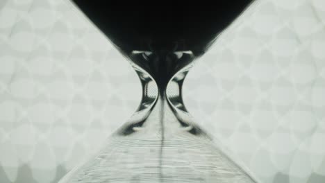 transparent hourglass and bokeh lights.