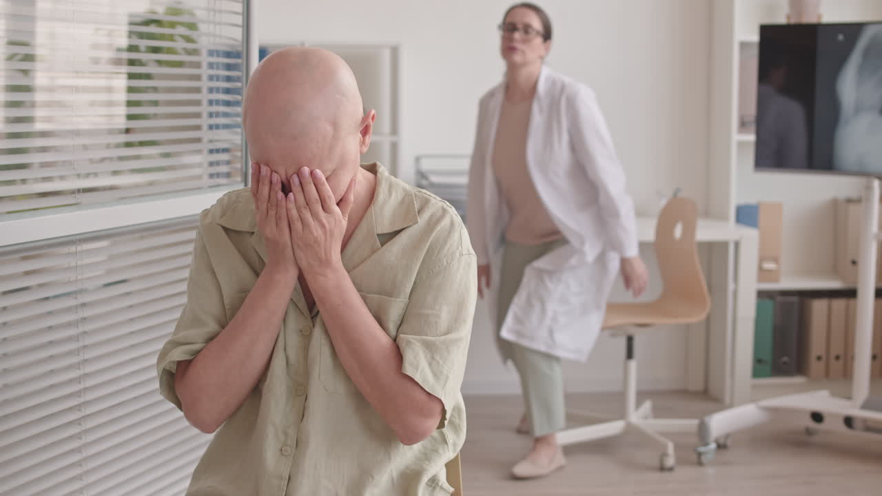 Female with Cancer Crying in Oncology Clinic