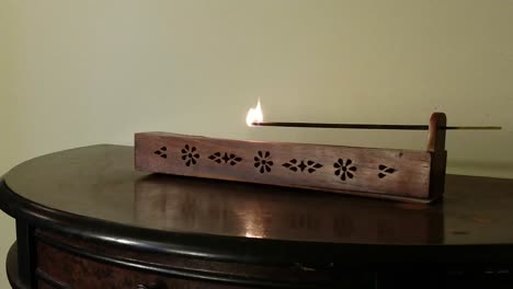 Man-Prepares-Incense-Burner-in-Closeup