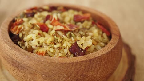 mixed bulgur with spices in wooden bowl