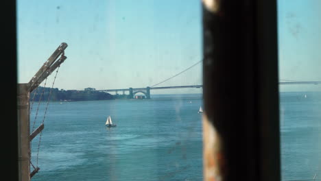 alcatraz prison, view of golden gate bridge and san francisco bay from window with metal bars