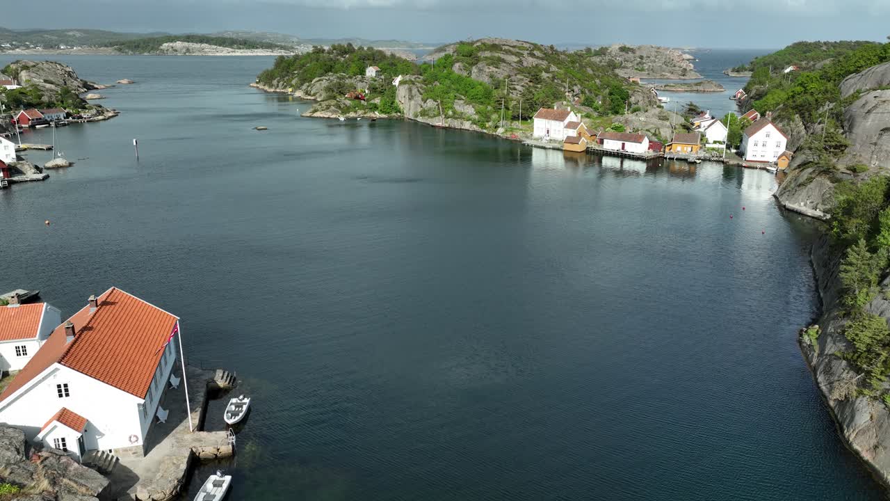 Clouds drifting over the tranquil setting of Ny-Hellesund.