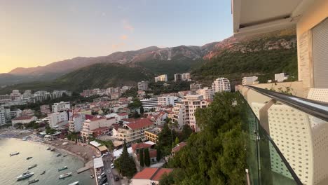 Mountains-over-a-small-fishing-town-in-montenegro-called-rafailovici-during-the-golden-hour-sunset,-this-video-was-shot-on-my-DJI-drone