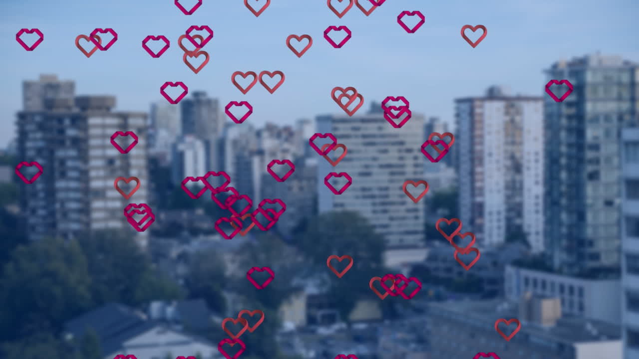 높은 건물의 공중 시야에 떠다니는 여러 개의 빨간 심장 아이콘의 애니메이션