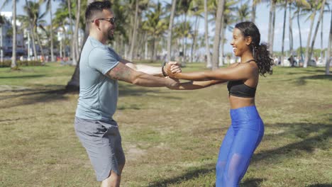 Cheerful-couple-working-out-in-nature