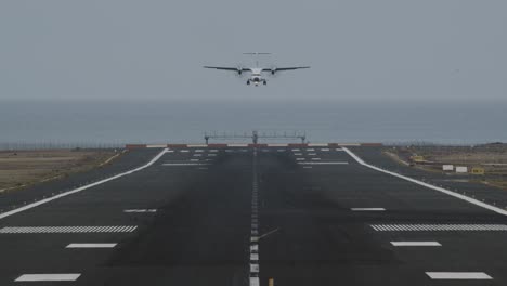 an airport runway with a landing plane