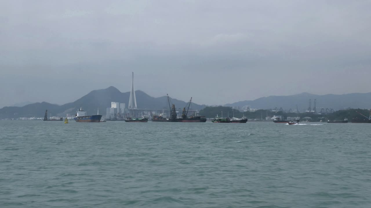View from the water of industrial shipping and fishing boats