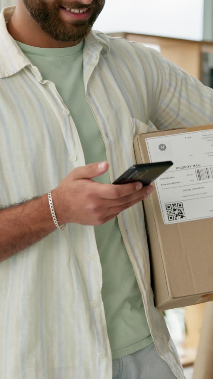 Man scanning a package with his phone
