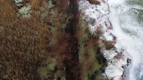 Aerial-View-Over-of-Flooded-Walking-Path-in-Stora-Vikens-Strandangar,-Sweden