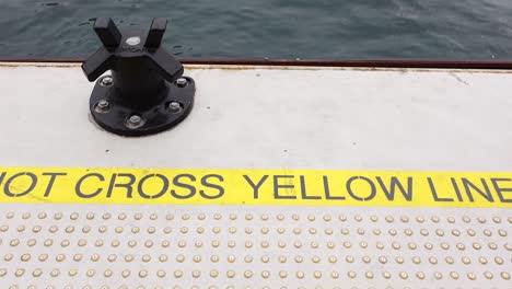 caution: do not cross yellow line on dock