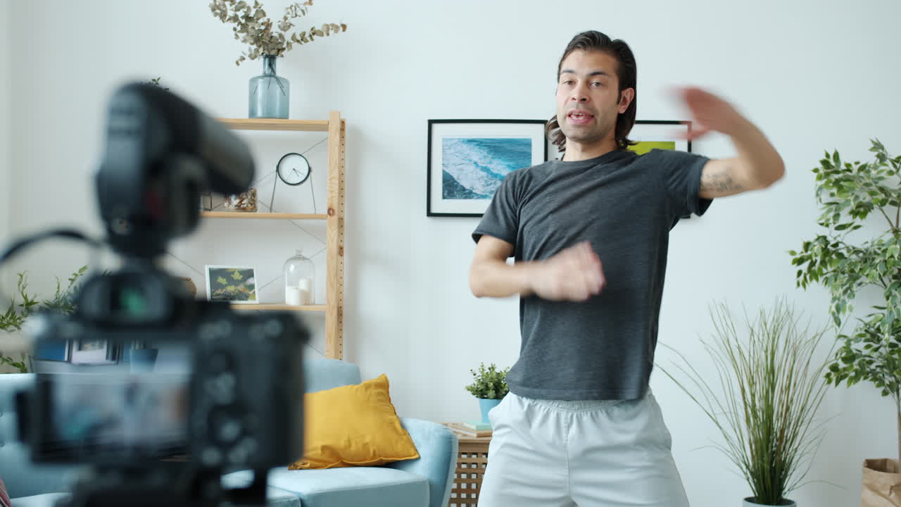 Man dancing in his home for a social media video