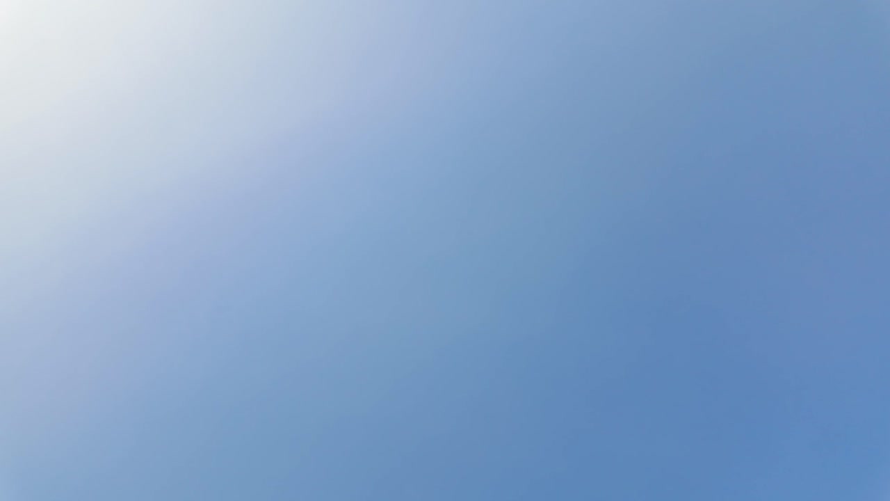 Clear blue sky views with a person and backpack